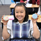 Student with Decorated Cookies
